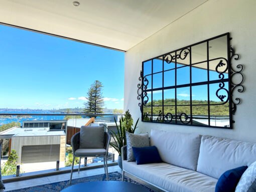 Beautiful wrought iron outdoor mirror Manly courtyard