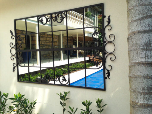 Iron garden mirror designef to be outdoors