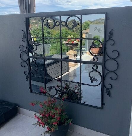 One of our Scrolled Gate design outdoor mirrors just hung on an ACT courtyard wall. Love how  it increases the sense of space and catches the neighbourhood views.#gardeninspiration #outdoorfurniture #backyardinspo #outdoorproject #outdoordesign #stylishaccessories #outdoorliving #outdoordesign #outdoormirrors #australiandesign #gardenaccessories #gardendesign #welovestyle #outdoorstyle #lovelifeoutdoors #stylishaccessories #gorgeousgarden #exteriordesign #outdoorspace #landscapearchitecture #outdoorliving #landscapedesigner #australiandesigner #landscapedesign #gardeninspiration #gardensofinstagram #backyardinspo #outdoorproject #outdoordesign