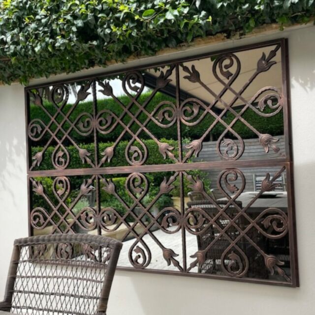 From our just hung files - Two of our Outdoor Mirrors were hung to style a small courtyard and catch garden glimpses.